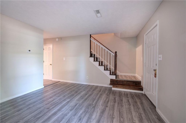 331 Leafmore Rd SW, Rome, GA 30165 - foyer entrance featuring wood finished floors, stairway, and baseboards