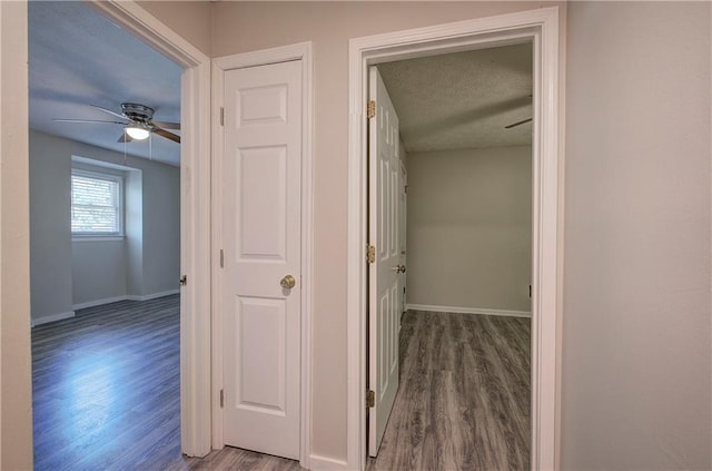 331 Leafmore Rd SW, Rome, GA 30165 - corridor with wood finished floors, baseboards, and a textured ceiling