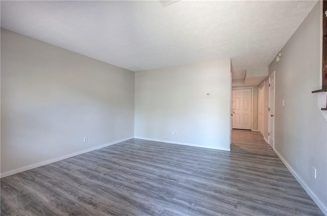 331 Leafmore Rd SW, Rome, GA 30165 - empty room featuring dark wood-type flooring and baseboards