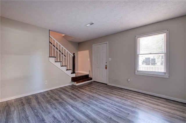 331 Leafmore Rd SW, Rome, GA 30165 - foyer entrance with wood finished floors, stairway, a textured ceiling, and baseboards