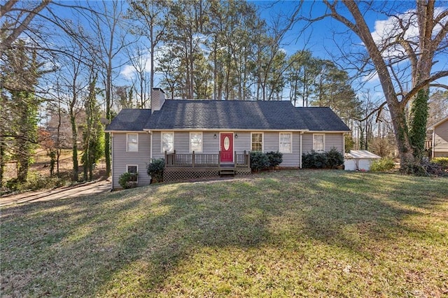 ranch-style house with a front yard and a deck