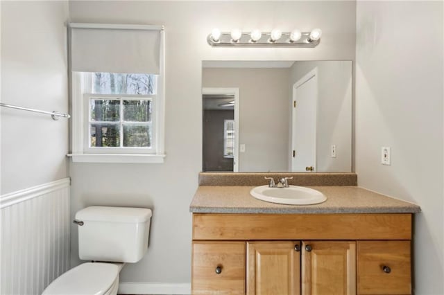 bathroom featuring vanity and toilet