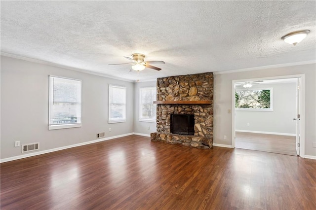 unfurnished living room with ceiling fan, a fireplace, and dark hardwood / wood-style flooring