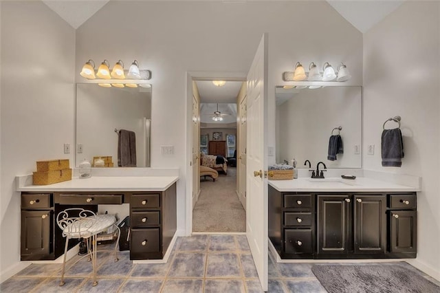 bathroom featuring tile patterned flooring, ceiling fan, vanity, and vaulted ceiling