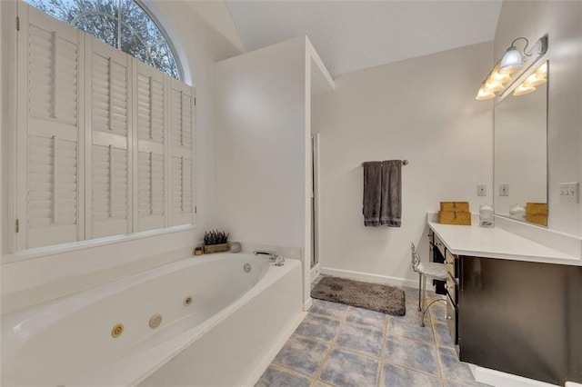 bathroom featuring tile patterned floors, vanity, separate shower and tub, and vaulted ceiling