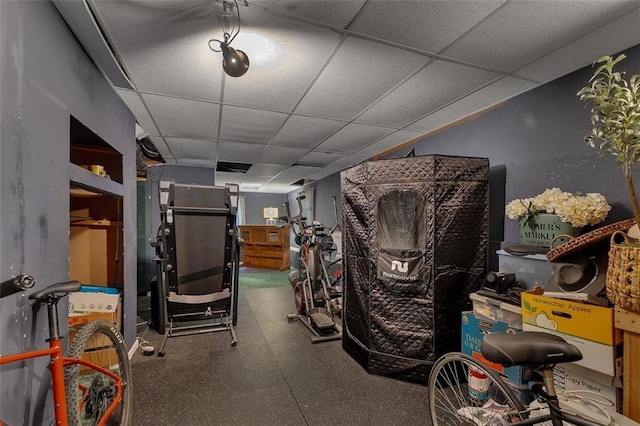 workout area featuring a drop ceiling