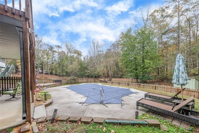 view of pool featuring a patio area