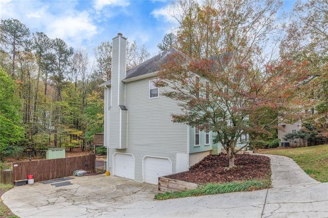 view of property exterior featuring a garage