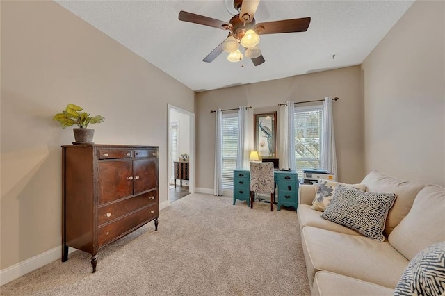 home office with ceiling fan and light colored carpet