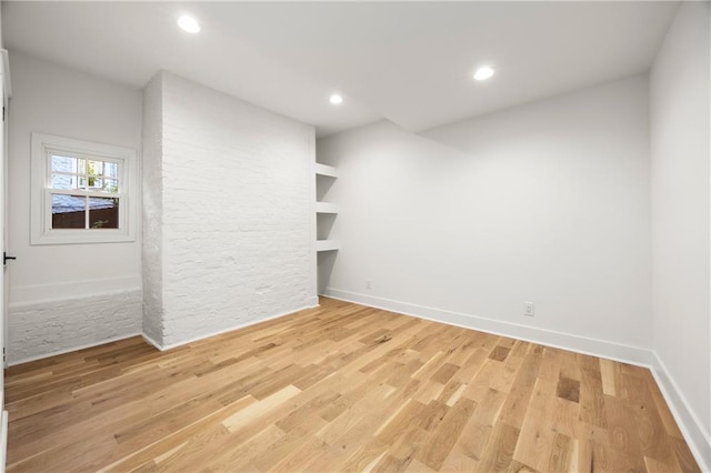 spare room with light wood-type flooring