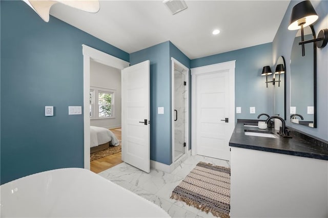 bathroom with vanity, hardwood / wood-style flooring, and independent shower and bath