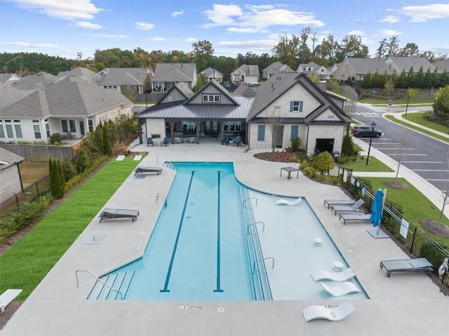 view of swimming pool with a patio area