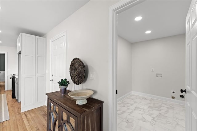 hall featuring recessed lighting, baseboards, and marble finish floor