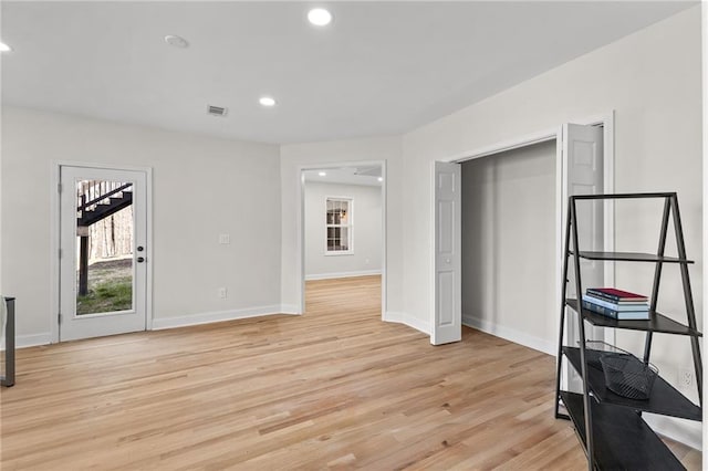 interior space featuring recessed lighting, visible vents, baseboards, and light wood-style flooring