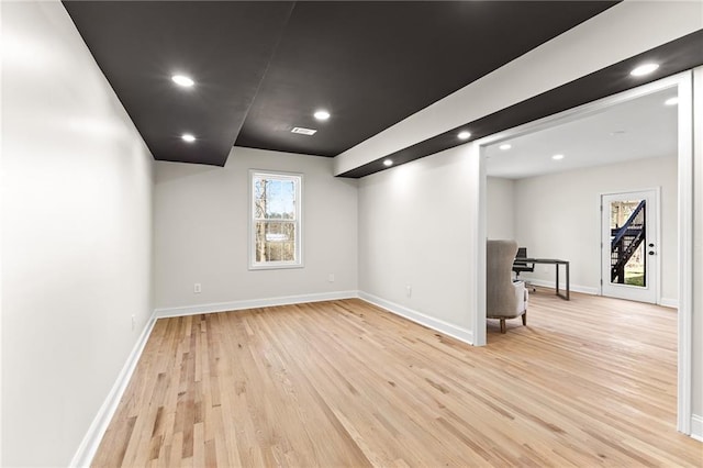 interior space with recessed lighting, light wood-style flooring, visible vents, and baseboards