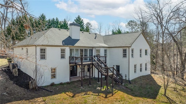 back of property with stucco siding, stairs, cooling unit, a wooden deck, and a chimney