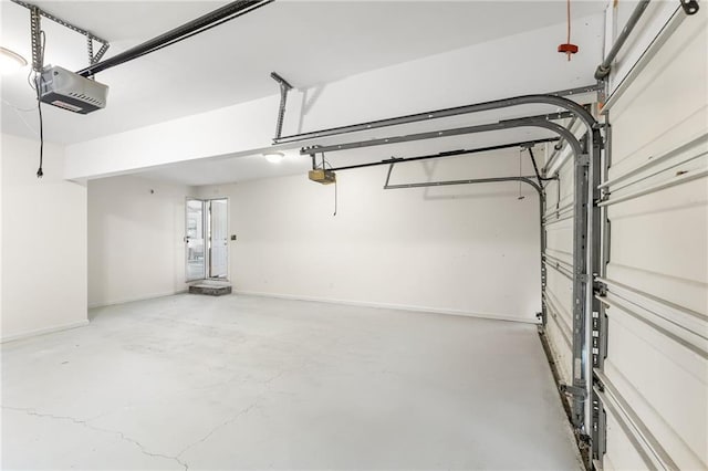 garage featuring baseboards and a garage door opener