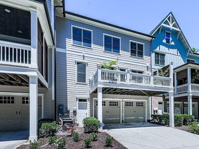 view of front facade featuring a balcony and a garage