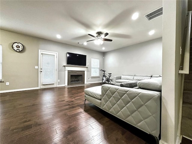 1015 Pebble Creek Trl, Suwanee, GA 30024 - living room with a ceiling fan, a fireplace, dark wood finished floors, baseboards, and visible vents