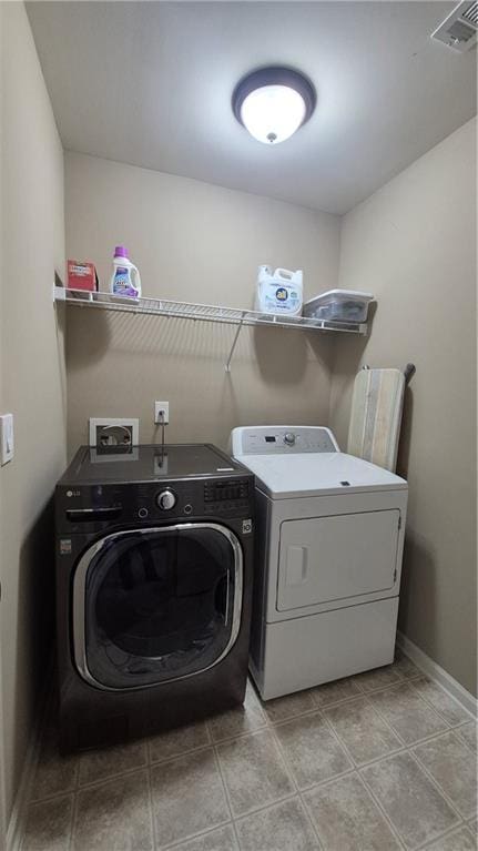1015 Pebble Creek Trl, Suwanee, GA 30024 - clothes washing area with separate washer and dryer, baseboards, visible vents, and laundry area