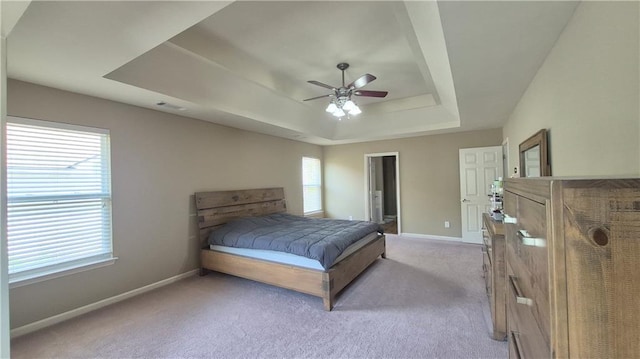 1015 Pebble Creek Trl, Suwanee, GA 30024 - carpeted bedroom featuring baseboards, a ceiling fan, a tray ceiling, and visible vents