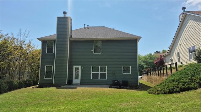 1015 Pebble Creek Trl, Suwanee, GA 30024 - rear view of property featuring a patio area, a lawn, central air condition unit, a chimney, and fence