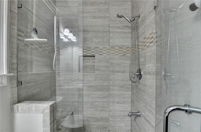 full bath with a shower stall