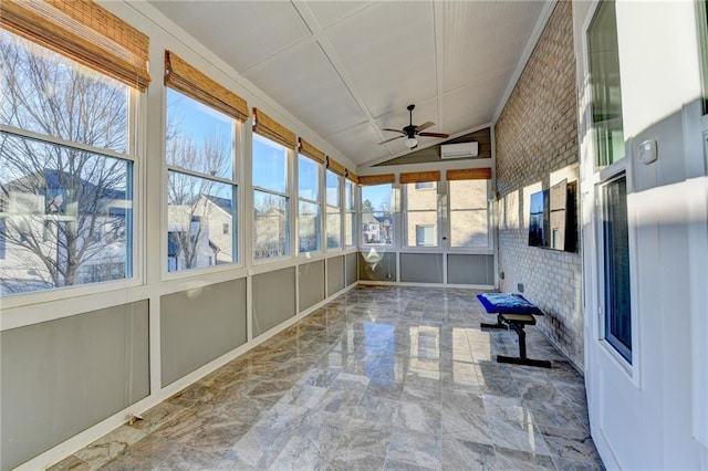 unfurnished sunroom featuring lofted ceiling and ceiling fan