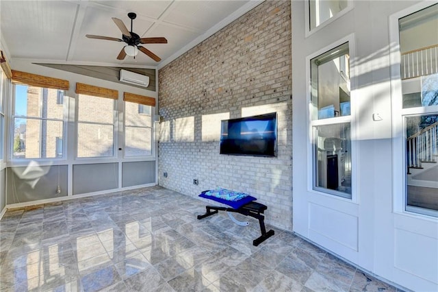 unfurnished sunroom with a wall unit AC and ceiling fan