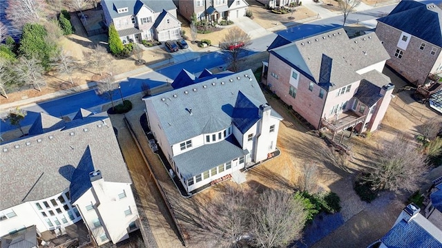 birds eye view of property with a residential view