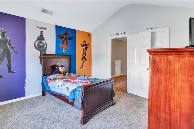 carpeted bedroom featuring lofted ceiling