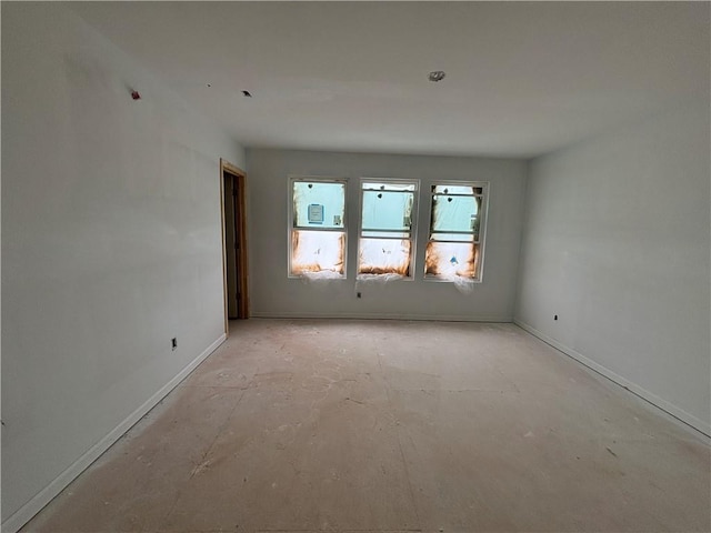 4428 Ryan St, Douglasville, GA 30135 - spare room featuring concrete flooring and baseboards