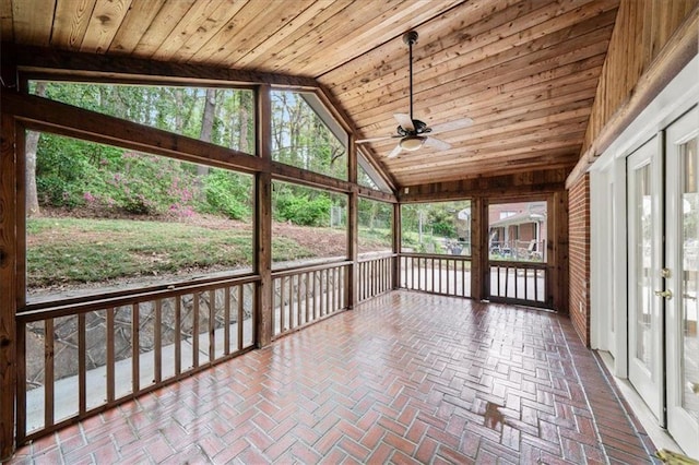 unfurnished sunroom with a ceiling fan