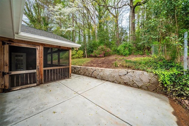 view of patio featuring a sunroom