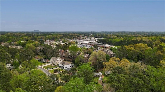 drone / aerial view featuring a forest view