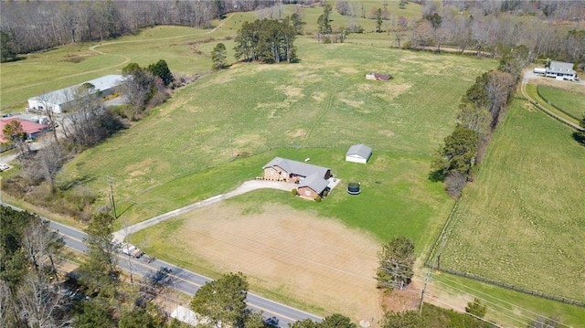 birds eye view of property with a rural view