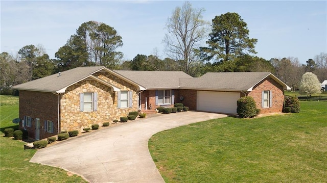 single story home featuring a garage and a front lawn