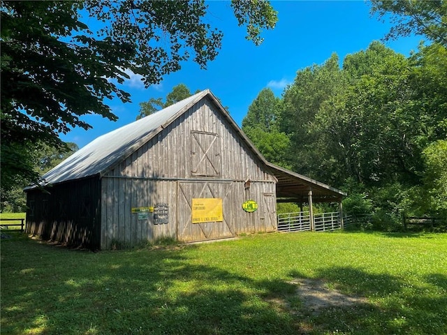 view of outbuilding featuring a yard