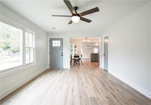 dining space featuring baseboards, visible vents, and wood finished floors