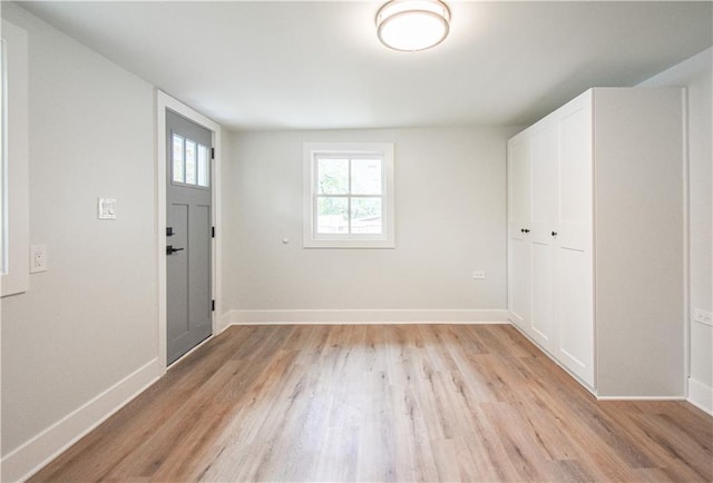 entryway with light hardwood / wood-style flooring