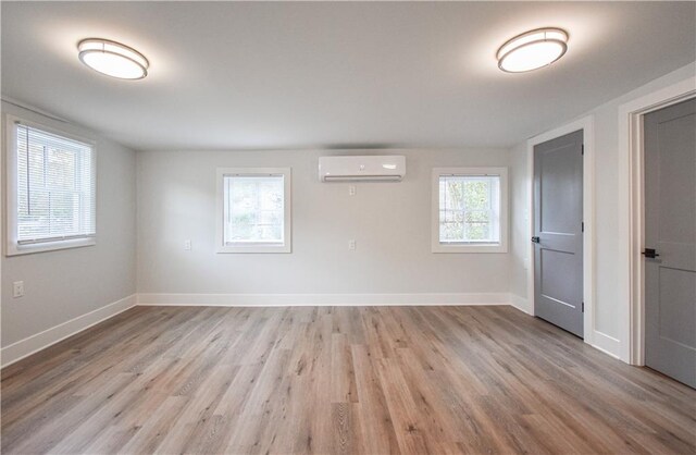 entryway with light wood finished floors and baseboards