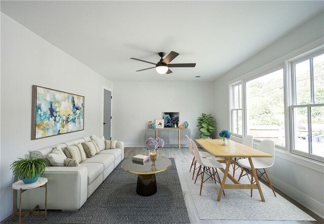 bedroom featuring light wood finished floors and baseboards