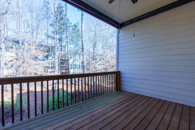 wooden terrace featuring ceiling fan