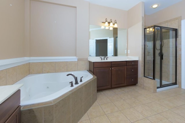 bathroom featuring vanity, shower with separate bathtub, and tile patterned floors