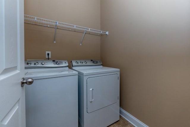 laundry room featuring washer and clothes dryer