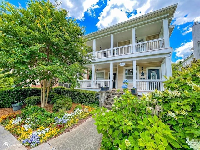 view of front of property with a balcony and covered porch