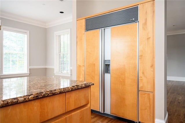 3657 Peachtree Rd NE Unit 4A, Atlanta, GA 30319 - kitchen featuring paneled built in refrigerator, stone countertops, dark wood-type flooring, and ornamental molding