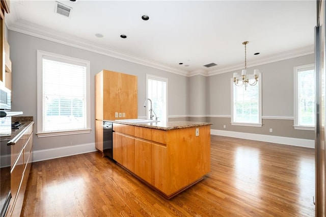 3657 Peachtree Rd NE Unit 4A, Atlanta, GA 30319 - kitchen featuring a chandelier, dishwasher, wood finished floors, crown molding, and stone counters