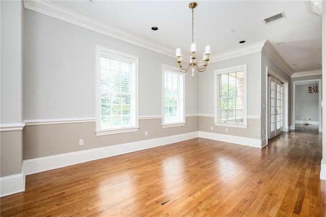 3657 Peachtree Rd NE Unit 4A, Atlanta, GA 30319 - unfurnished room with wood finished floors, a chandelier, and crown molding