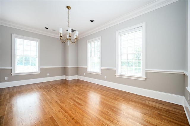 3657 Peachtree Rd NE Unit 4A, Atlanta, GA 30319 - spare room featuring a chandelier, ornamental molding, and light wood finished floors